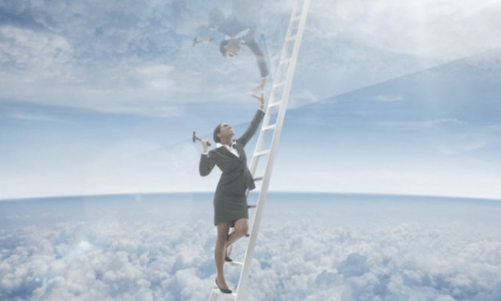 Woman breaking glass ceiling