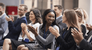 women clapping in crowd