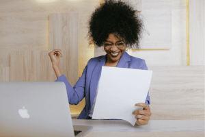 woman excited with white paper