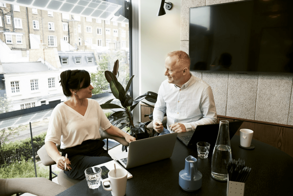 business man and woman sitting and discussing ideas